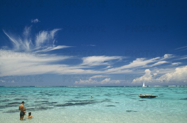PACIFIC ISLANDS, Polynesia, Society Islands, Moorea.  Beach and tourist sunbathers and swimmers.