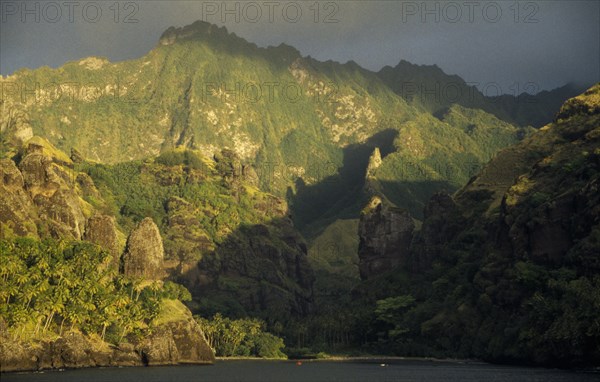 PACIFIC ISLANDS, Polynesia, Marquesas Islands, Fatu Hiva Island.  Landscape near Hanavave at sunset.