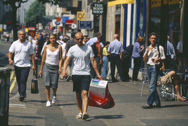 ENGLAND, London, Oxford Street shoppers and pedestrians.