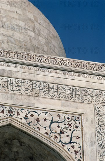 INDIA, Uttar Pradesh, Agra, Detail of semi precious stones inlaid in white marble with Arabic script quoting from the Koran on the Taj Mahal