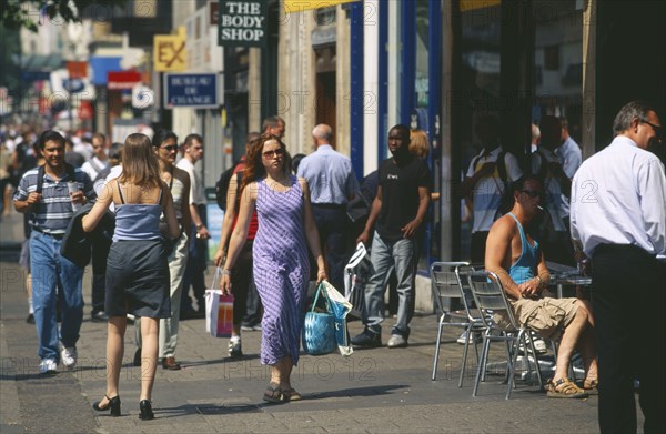ENGLAND, London, Oxford Street. Pedestrians and shoppers.
