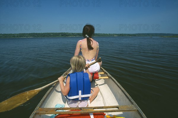 FAMILY, Children, Mother and Child, Mother and daughter canoeing on the Westport River in Massachusetts USA