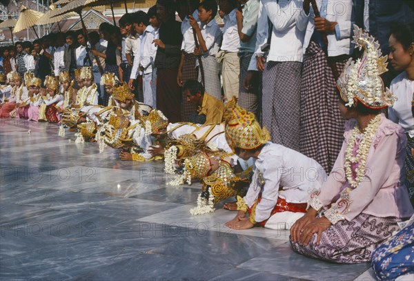 MYANMAR, Religion, Shwedagon Pagoda.  Initiation of novices monks and nuns at Shinpyu ceremony.