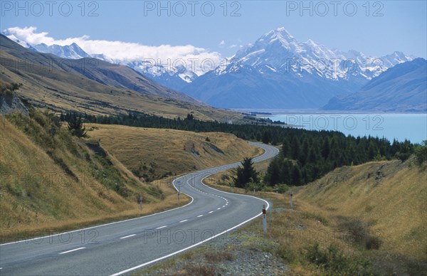 NEW ZEALAND, South Island, Lake Pukaki, View looking north along the lake and road running to Mount Cook National Park