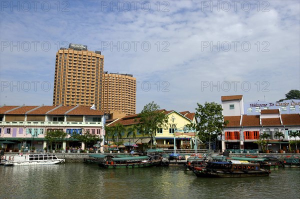 SINGAPORE, General, Junks on Singapore River with city architecture on the opposite bank