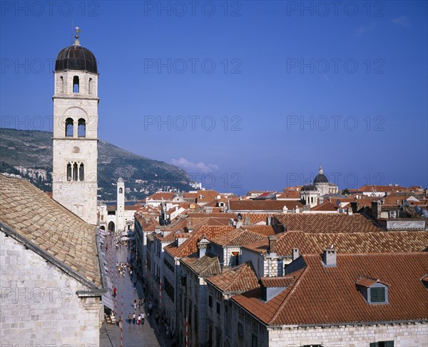 CROATIA, Dalmatia, Dubrovnik, Aerial view over the Placa or main street from Pile Gate looking toward the Cathedral dome