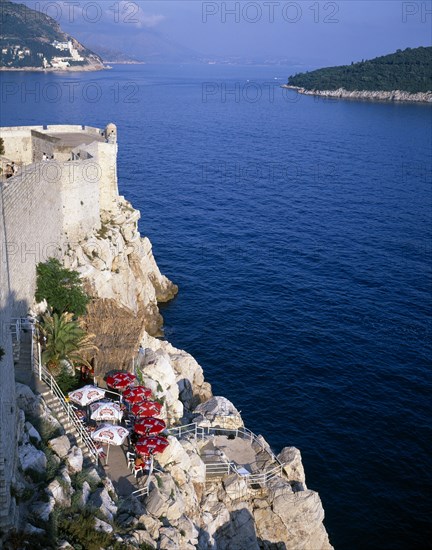 CROATIA, Dalmatia, Dubrovnik, Bar on cliff outside the City Wall or Gradske Zidine facing Kolocep Island