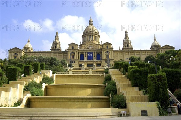 SPAIN, Catalonia, Barcelona, Royal Palace Museum facade with domed roof and steps leading down to the foreground.