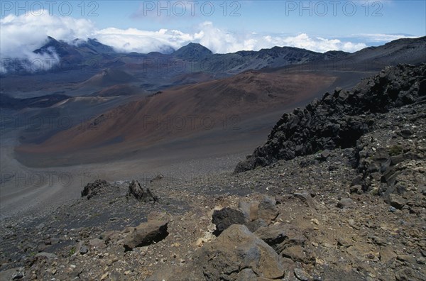 USA, Hawaii, Maui, Cinder cones and iron rich lava weathered to brown oxide in the vast crater of Haleakala Volcano