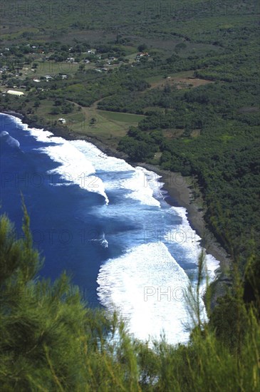 USA, Hawaii, Molokai, Kalaupapa. Aerial view looking down on bay and green coastline