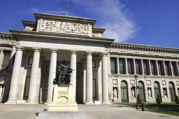 SPAIN, Madrid, Prado Museum columned entrance with statue outside