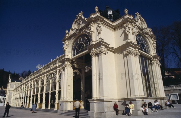 CZECH REPUBLIC, West Bohemia, Marienbad, Exterior of spa with arched windows colonnade and multiple carved figures and decorative motifs