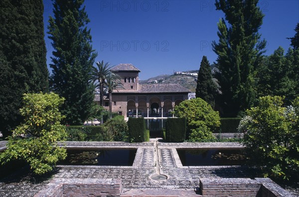 SPAIN, Andalucia, Granada, Alhambra Palace. The Alcazaba. Jardins de Partal with the Palace of the Maids in the background
