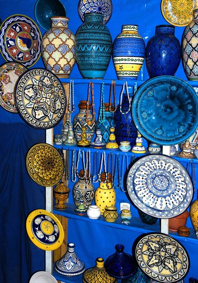 MOROCCO, Marrakech, Display of brightly coloured ceramic vases and plates