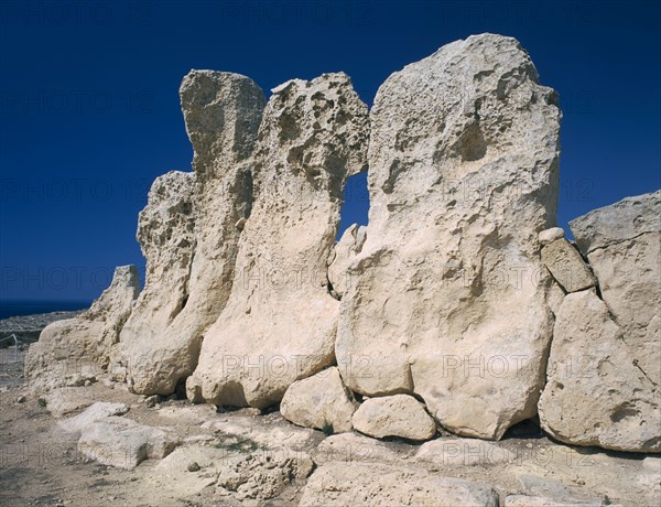 MALTA, Marsaxlokk, Hagar Qim prehistoric site with view of rocks of the temple’s boundary wall.