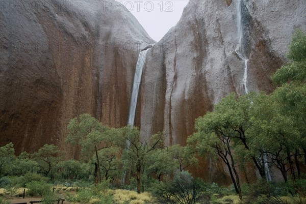 AUSTRALIA, Northern Territories, Uluru, Ayers Rock.  Waterfalls at Maggie Springs or Mutidjula caused by rainstorm.