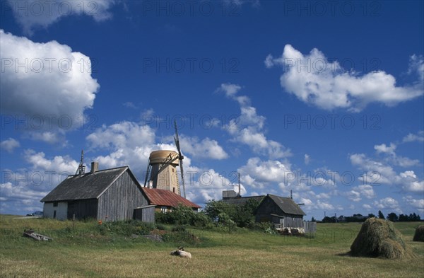 ESTONIA, Saaremaa Island, Farm buildings haystack and windmill