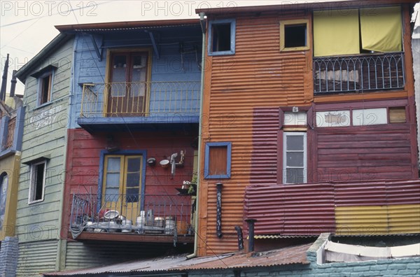 ARGENTINA, Buenos Aires, La Boca.  Brightly painted houses in the old port district.