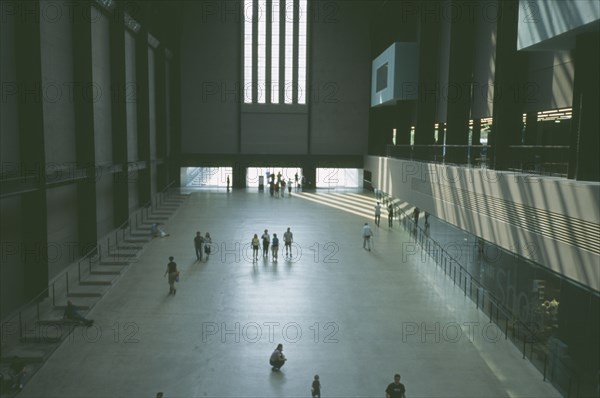 ENGLAND, London, Tate Modern. View over the Old Turbine Hall main entrance with scattering of visitors