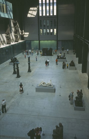 ENGLAND, London, Tate Modern. View over the Old Turbine Hall with modern sculpture exhibits and visitors