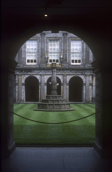 SCOTLAND, Lothian, Edinburgh, Holyrood Palace internal courtyard with surrounding colonnades and central monument