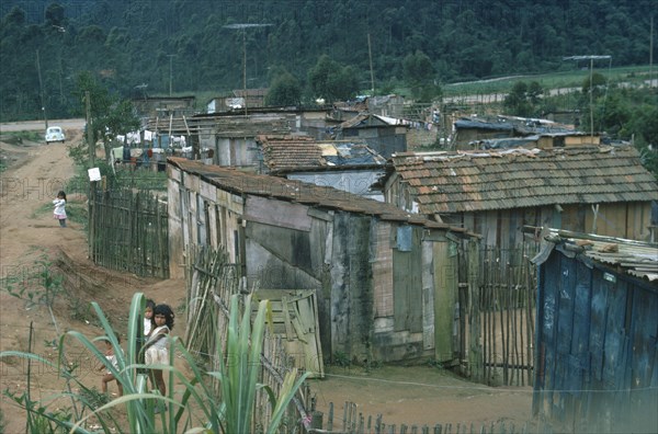 BRAZIL, Sao Paulo, Favela slum area with children in foreground.