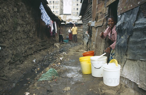 KENYA, Nairobi, Mathare Valley, Village One residents in the narrow alleys of the notorious no go slum without sanitation being cleaned up by residents after cholera outbreaks