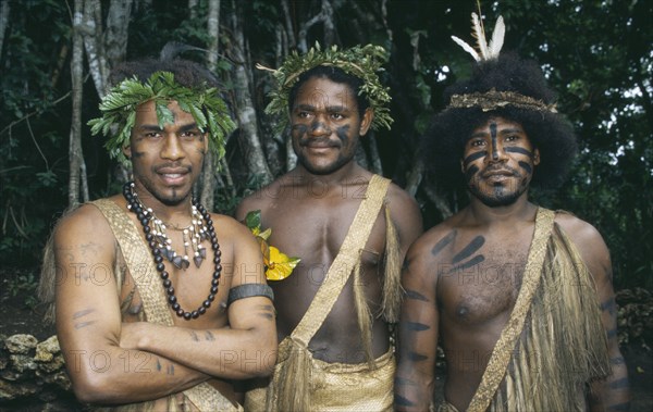 PACIFIC ISLANDS, Melanesia, Vanuatu, Port Vila.  Three men wearing traditional dress and body decoration.