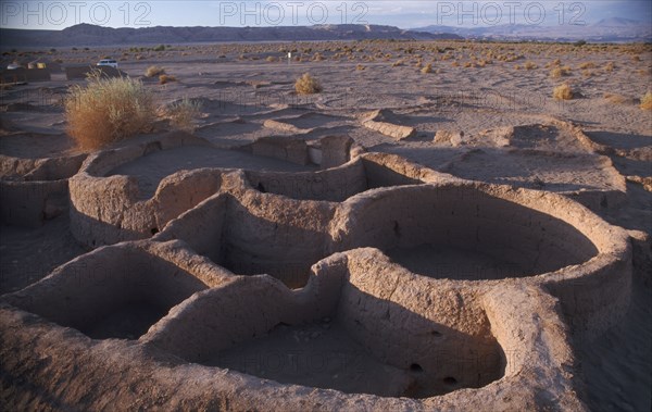 CHILE, Atacama Desert, Excavated village dwellings in desert landscape.