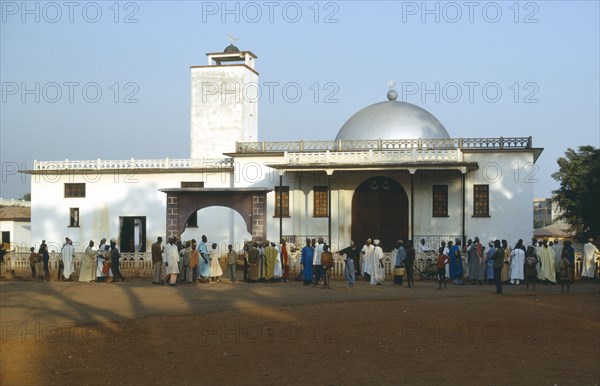 CAMEROON, Foumbam, Crowds at exterior to mosque like building at the begining of the Fete Foumbam to mark the end of Ramadam.
