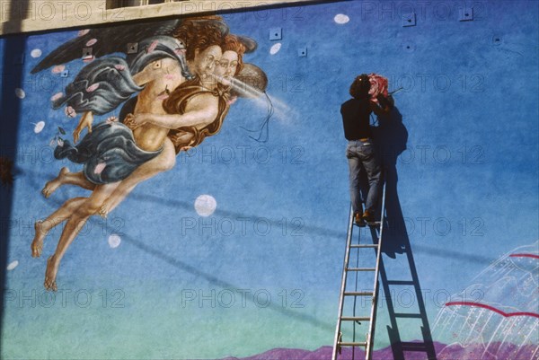 USA, California, Los Angeles, Painter working on mural based on Botticelli painting of Venus.