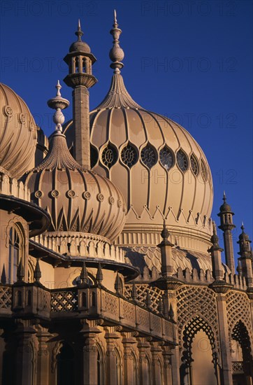 ENGLAND, Sussex, Brighton, Brighton Pavilion exterior section showing onion domes in evening light