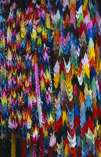 JAPAN, Honshu, Hiroshima, Peace Memorial Park. Mass of multi coloured origami cranes at the Childrens Peace Monument