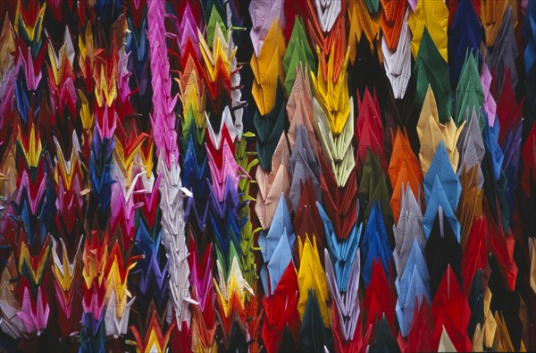 JAPAN, Honshu, Hiroshima, Peace Memorial Park. Mass of multi coloured origami cranes at the Childrens Peace Monument