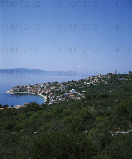 CROATIA, Dalmatia, Igrane, View over coastal town and bay with Hvar Island in the distance