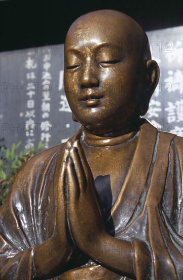 JAPAN, Honshu, Tokyo, Asakusa. Nadi Botokesan Buddha statue at Senso Ji Temple