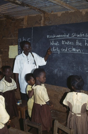 GHANA, West, Education, Teacher and children in primary school studying environmental issues.