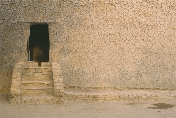 MALI, Djenne, "Mud house, exterior detail with steps leading to doorway"