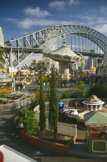 AUSTRALIA, New South Wales, Sydney, View toward Harbour Bridge and the Opera House from Luna Park amusements