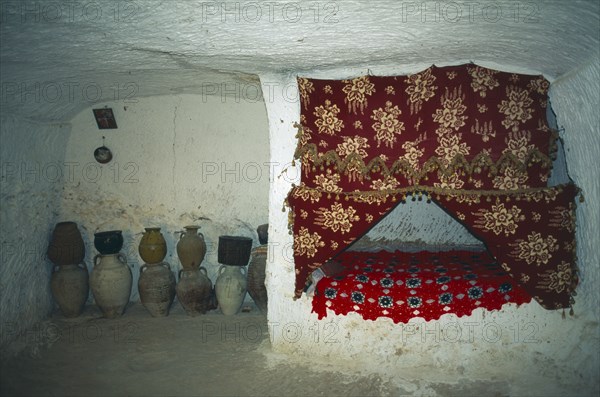 TUNISIA, Zaraoua, "Berber home, interior room cut from rock"