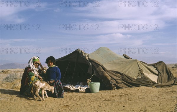 ALGERIA, People, Women, Berber woman and child outside tent