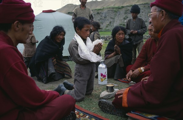 NEPAL, Mustang, High ranking Lama performing hair cutting ceremony.