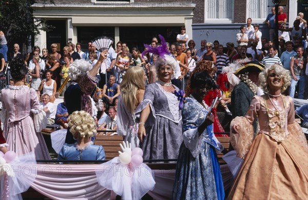 HOLLAND, Noord, Amsterdam, Gay Pride canal parade with men dressed in historical womens cotumes