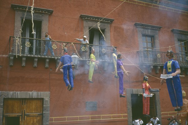MEXICO, Guanajuato, San Miguel de Allende, Exploding papier-mache Judas Iscariot figures in the Plaza Principal during the Easter Sunday celebrations at the end of  Holy Week.
