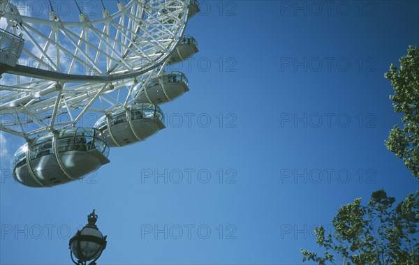 ENGLAND, London, British Airways London Eye Milennium wheel partial view with lamppost in the foreground