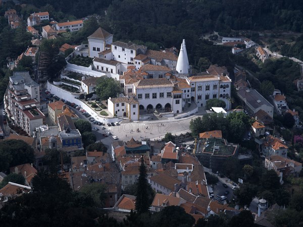 PORTUGAL, Sintra, Aerial view looking down on the town and Palacio Nacional de Sintra.