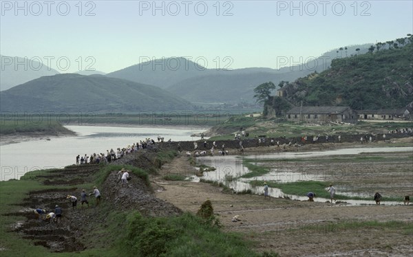 CHINA, Zhejiang, Flooding, Rebuilding river defences after flood disaster