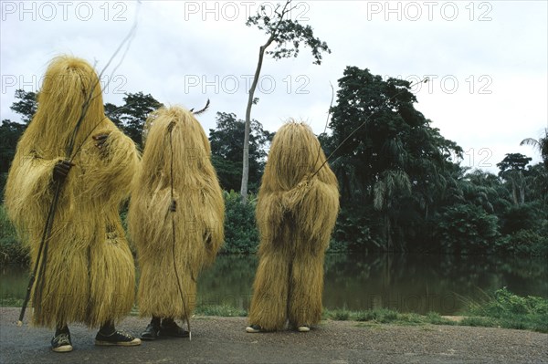 NIGERIA, Traditional Dress, Yoruba Egungun masqueraders at the source of the River Oshon