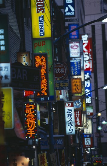 JAPAN, Honshu, Tokyo, Shinjuku. Mass of illuminated advertising signs