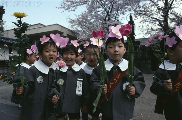 JAPAN, Honshu, Tokyo, Asakusa.  Nursery school children dressed for Hana Matsuri flower festival for Buddhas birthday.